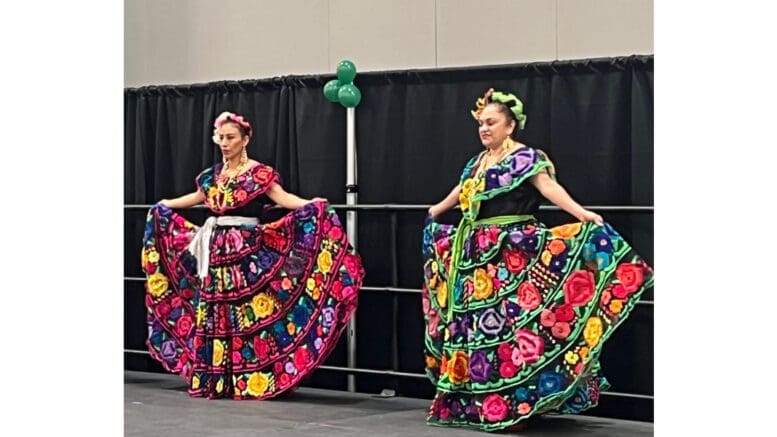 Two dancers in colorful costumes