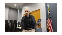 William Marchione with hands in pockets, speaking