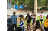 School board member Tre Hutchins surprised the recently retired Toulson family, former owners of Premier Learning Academy, with a bouquet of flowers