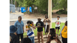 School board member Tre Hutchins surprised the recently retired Toulson family, former owners of Premier Learning Academy, with a bouquet of flowers