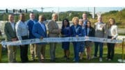 Officials behind ribbon before cutting at the Bob Callan Trail