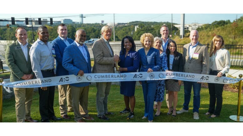 Officials behind ribbon before cutting at the Bob Callan Trail
