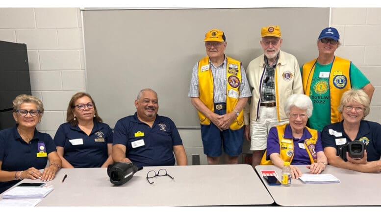 A group from area Lions Clubs at a vision screening table