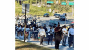 A large crowd marching in the Faith & Blue March