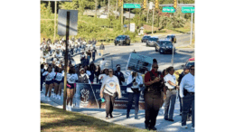 A large crowd marching in the Faith & Blue March
