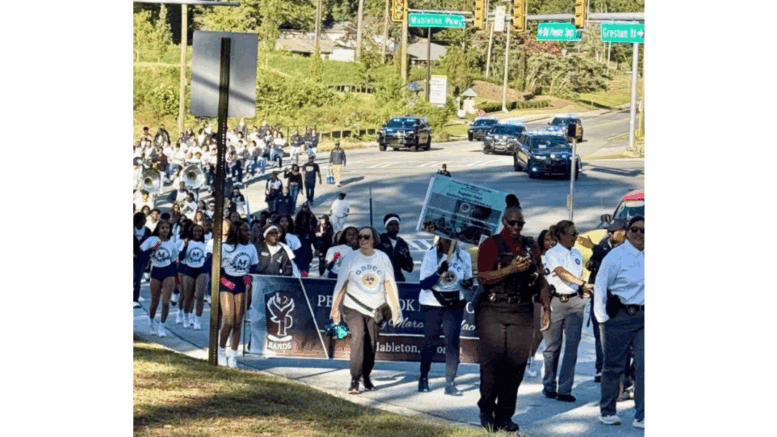 A large crowd marching in the Faith & Blue March