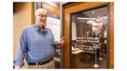 Robert Williams at the entrance to the KSU Rare Book Museum named after him