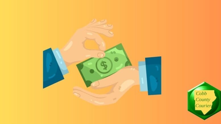 a pair of hands passing off cash