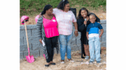 Mikailah Peoples and family at new home site