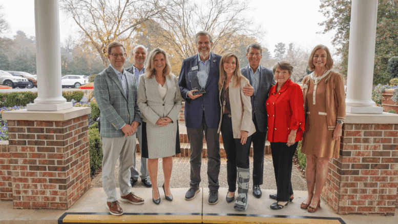 Michael Paris hold award, flanked by Chamber and East Cobb council officials