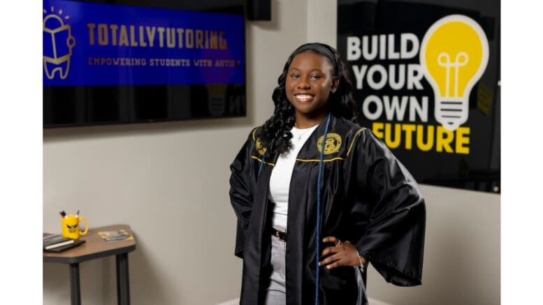 Toni-Ann McKenzie wearing graduation robe