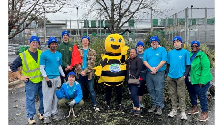 Group photo of Boy Scout Troop 22 and South Cobb Lions Club volunteers at Christmas tree recycling event