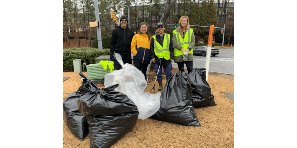 Group photo of Keep Smyrna Beautiful volunteers with bags of collected litter