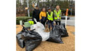 Group photo of Keep Smyrna Beautiful volunteers with bags of collected litter