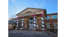 Smyrna's Max Bacon City Hall with Christmas decorations on the columns