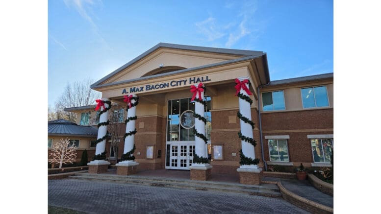 Smyrna's Max Bacon City Hall with Christmas decorations on the columns