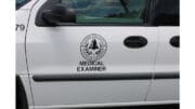 The logo on the side of the Cobb County Medical Examiner's vehicle