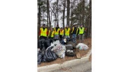 Group photo of Keep Smyrna Beautiful volunteers with bags of litter picked up