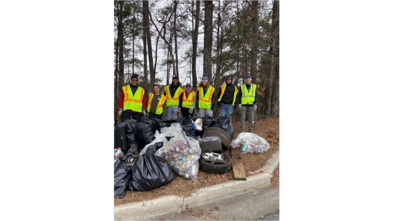 Group photo of Keep Smyrna Beautiful volunteers with bags of litter picked up