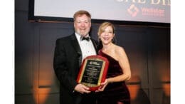 Outgoing Chamber Chairman, Chris Britton of Brasfield & Gorrie, passing the leadership to 2026 Chairwoman, Melissa Cantrell of CDH Partners