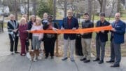Group photo of the ribbon-cutting for a Little Free Library in Marietta