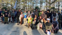 Group photo of participants in "Sweep the Hooch" river cleanup in Discovery Park in Mableton