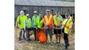 Group photo of volunteers at the Concord Covered Bridge litter cleanup