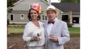 A woman and man dressed in Kentucky Derby-themed garb