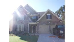 4099 Bunker Dr in South Cobb, highest-priced home sale of March 2026 at $550,000, two-story brick house with large driveway and front yard