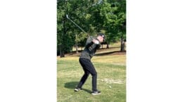 Photo of a golfer mid-swing at the Sweetwater Mission Annual Golf Tournament