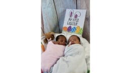 2 babies in Wellstar Cobb Neonatal ICU with a sign "My first Easter"