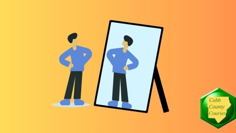 A man posing in front of a mirror