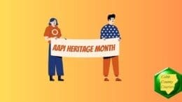 A woman and man holding an AAPI Heritage Month banner