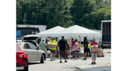 Photo of people at tents in Maximum Impact Love event by metro Atlanta churches