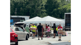 Photo of people at tents in Maximum Impact Love event by metro Atlanta churches