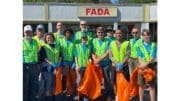 Boy Scout Troop 22 litter cleanup group photo with orange litter bags and yellow safety vests