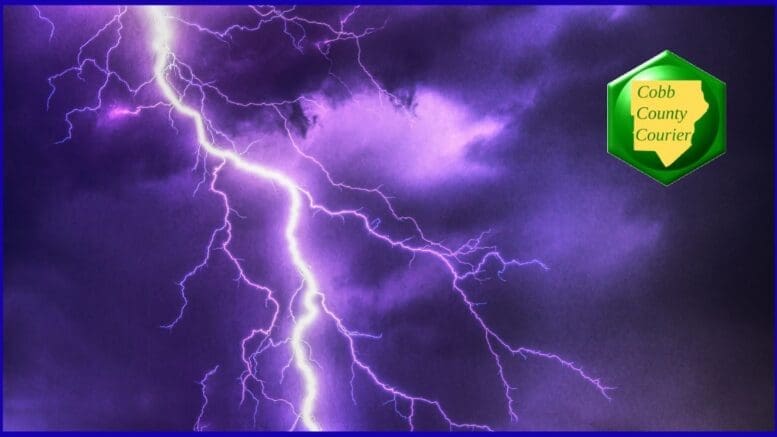 Photo of a thunderstorm with a large bolt of lightning