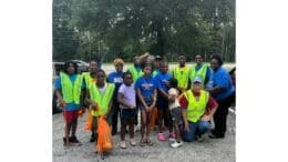 Group photo of We Thrive on Riverside cleanup volunteers