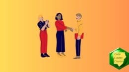 Three people in conversation, two of them shaking hands